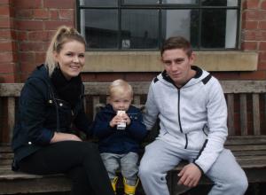 two of the parents with their son