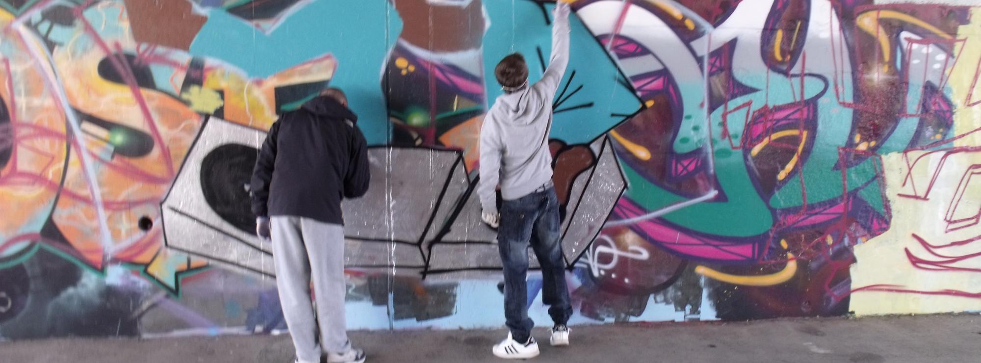 Young people creating urban art