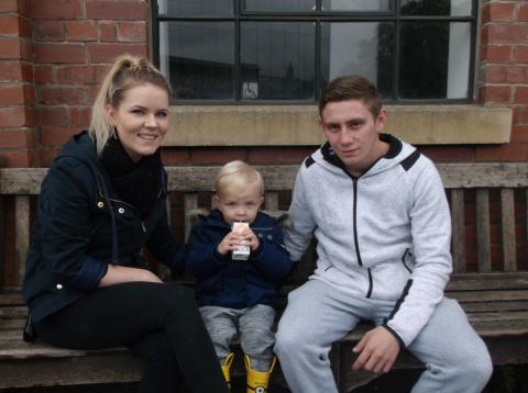 two of the parents with their son